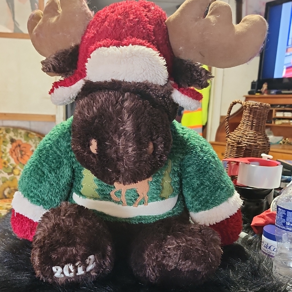 Festive Moose Plush Toy with Red and Green Outfit.